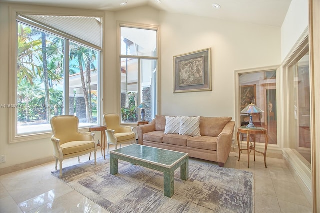 2941 Paddock Ln, Weston, FL 33331 - living room featuring lofted ceiling, light tile patterned floors, and baseboards