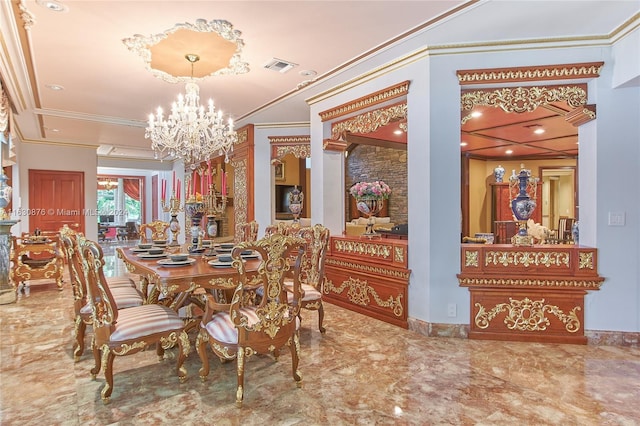 dining room with crown molding, an inviting chandelier, and tile patterned flooring