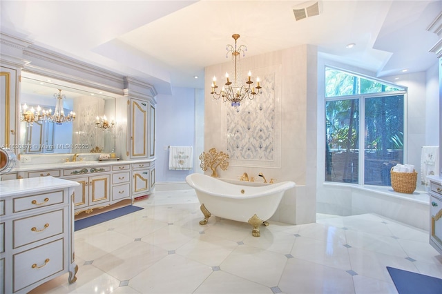 2941 Paddock Ln, Weston, FL 33331 - bathroom featuring a chandelier, a freestanding tub, and vanity