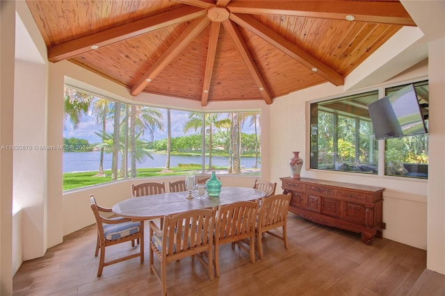 dining room with wooden ceiling and a healthy amount of sunlight