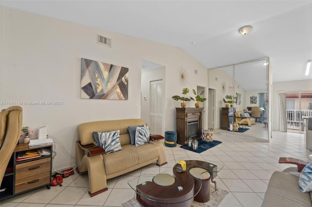 tiled living room featuring lofted ceiling