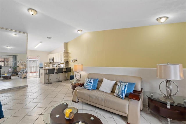 tiled living room featuring vaulted ceiling