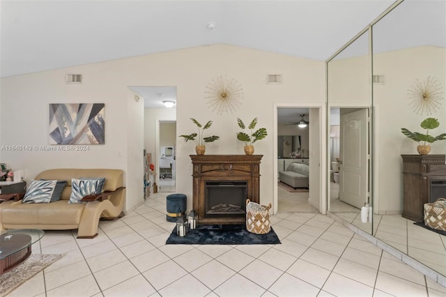 tiled living room with vaulted ceiling and ceiling fan