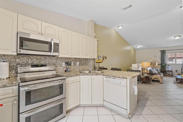 kitchen with tasteful backsplash, white cabinets, kitchen peninsula, stainless steel appliances, and sink