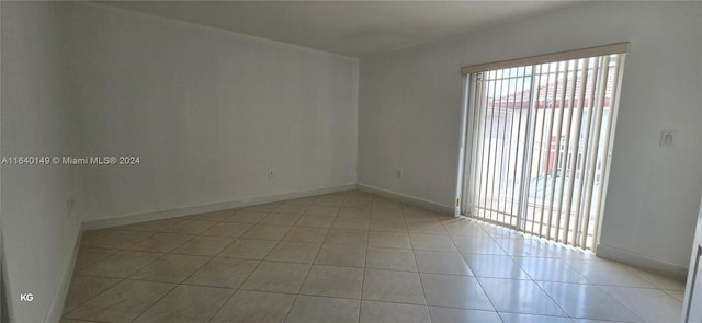 spare room featuring light tile patterned floors