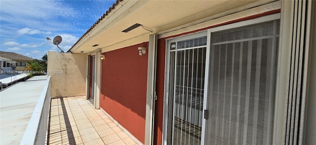 view of side of property with a balcony