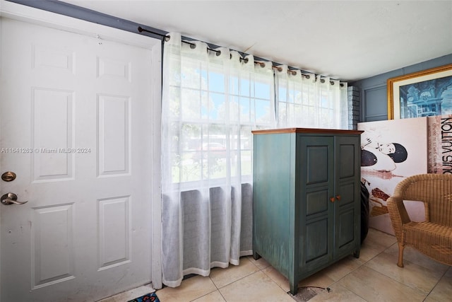 interior space featuring a healthy amount of sunlight and tile patterned floors