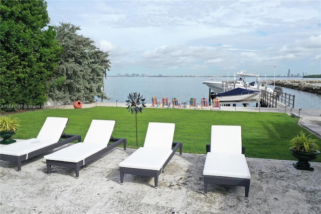 view of patio with a water view