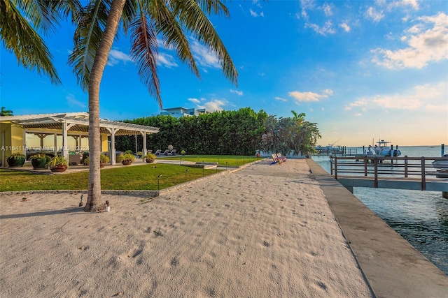 200 Harbor Dr, Key Biscayne, FL 33149 - surrounding community with a pergola, a yard, a boat dock, and a water view