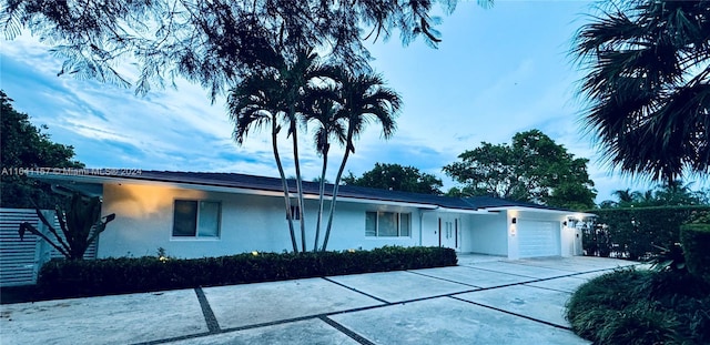 single story home featuring a garage