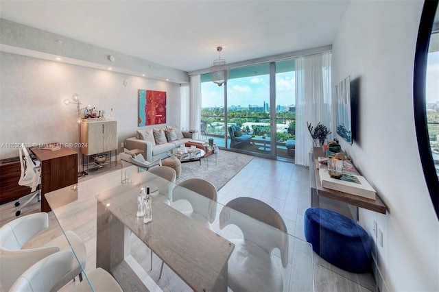 living room featuring floor to ceiling windows and wood-type flooring