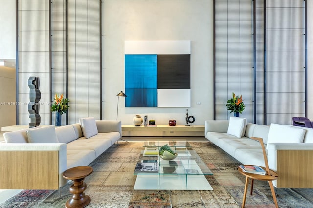 living room featuring a high ceiling