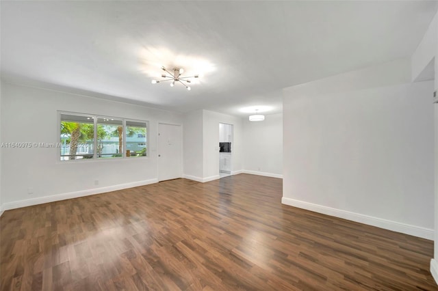 spare room featuring dark hardwood / wood-style floors