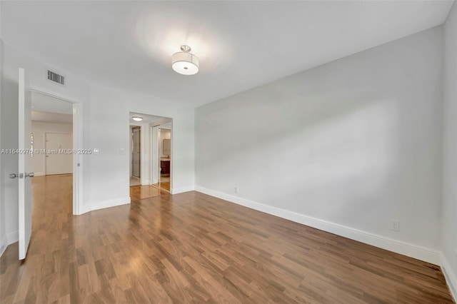 spare room featuring hardwood / wood-style floors