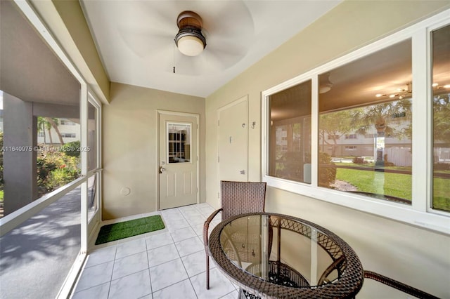 sunroom / solarium with ceiling fan