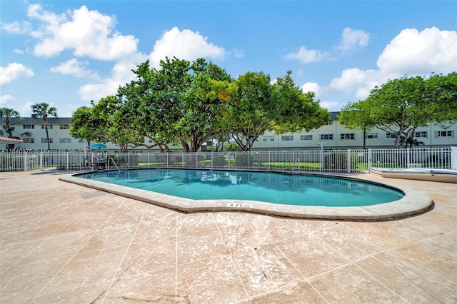 view of swimming pool featuring a patio