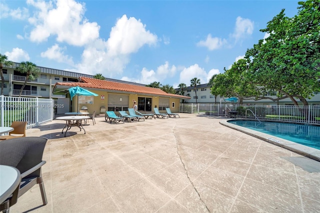 view of swimming pool with a patio area