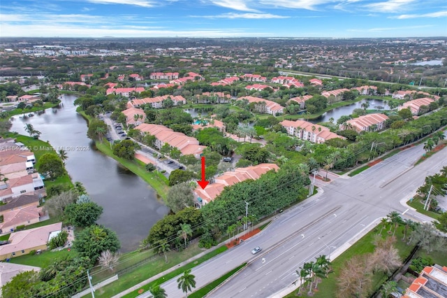 birds eye view of property featuring a water view