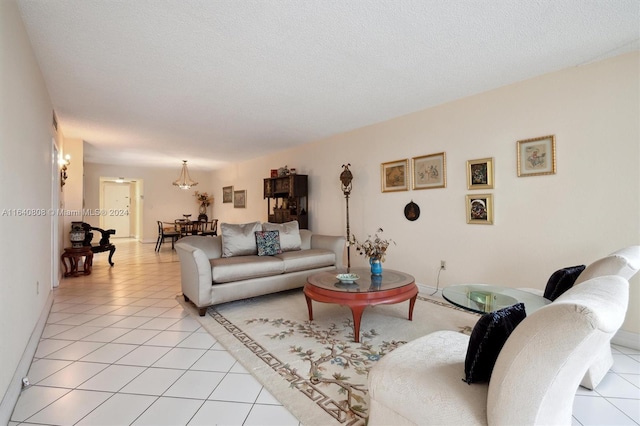 living room with a textured ceiling and light tile patterned floors