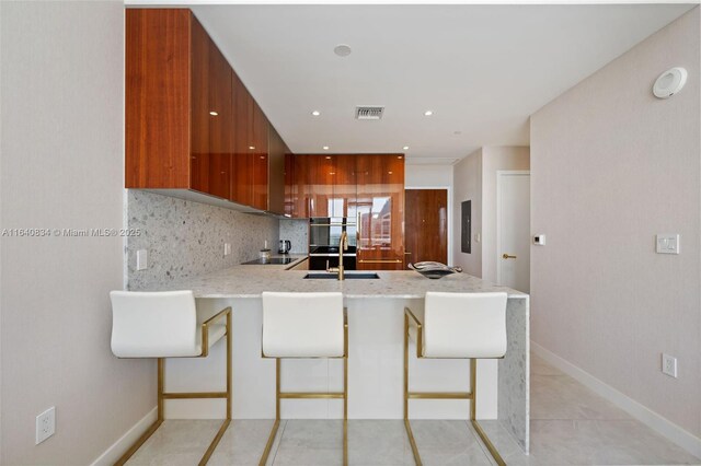 living room with light tile patterned floors and sink