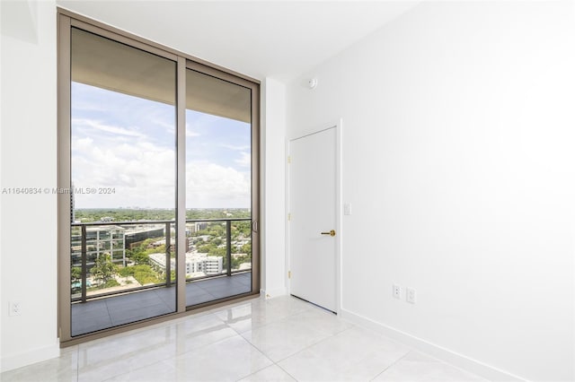 unfurnished room with light tile patterned floors