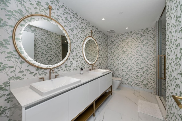 bathroom with a sink and wallpapered walls