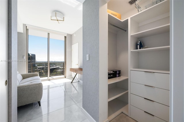 walk in closet featuring visible vents and tile patterned floors