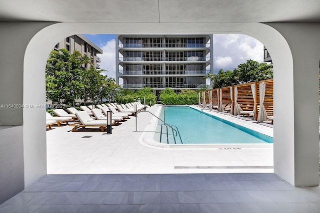 community pool with a patio area