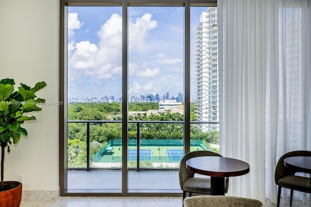 doorway featuring a city view and speckled floor