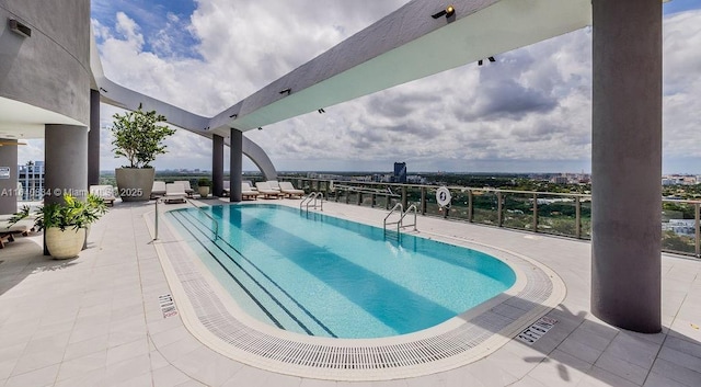 view of swimming pool with a patio area