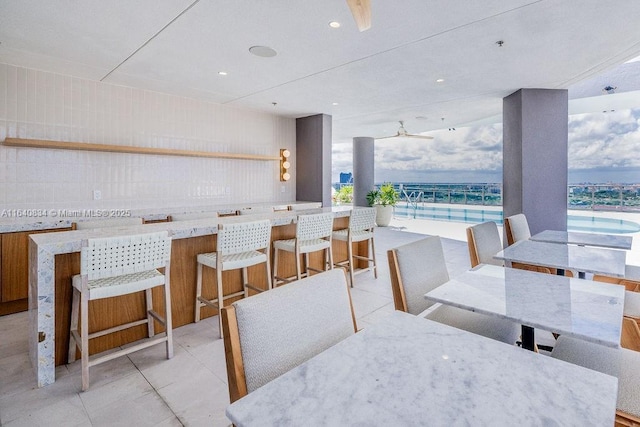 dining space featuring recessed lighting