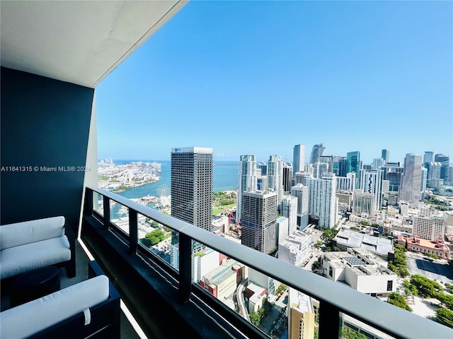 balcony featuring a water view