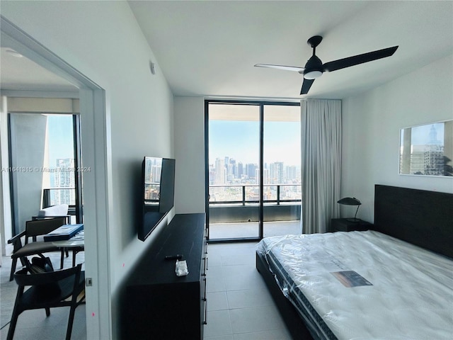 bedroom with ceiling fan, access to exterior, and tile patterned flooring