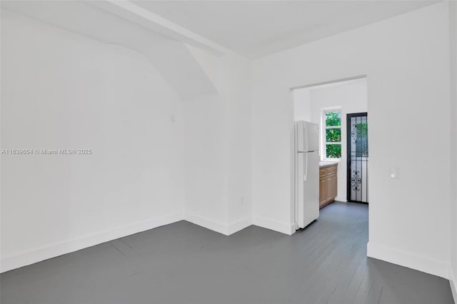 unfurnished room with dark hardwood / wood-style floors