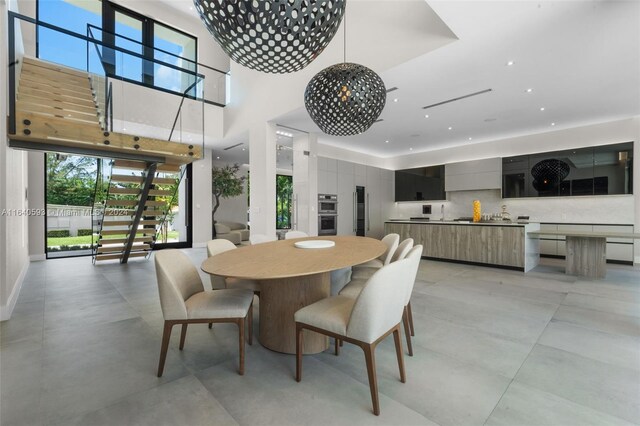 dining room featuring light tile patterned flooring and an inviting chandelier