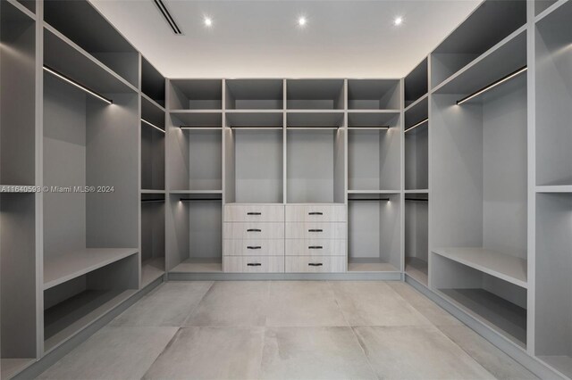 walk in closet featuring light tile patterned floors