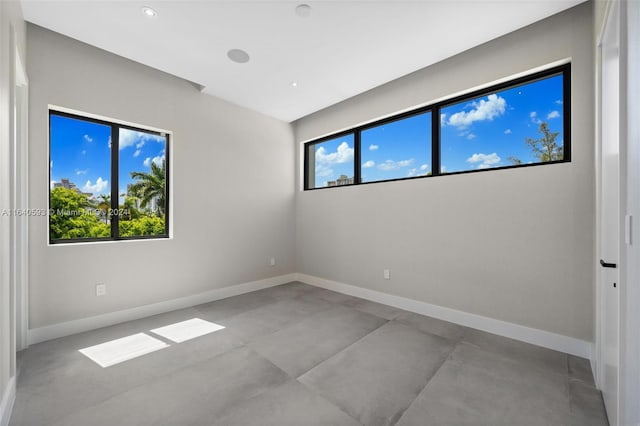 unfurnished room featuring plenty of natural light