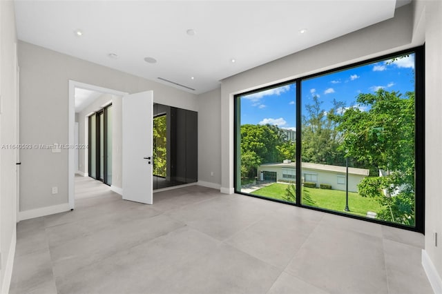 empty room with light tile patterned floors