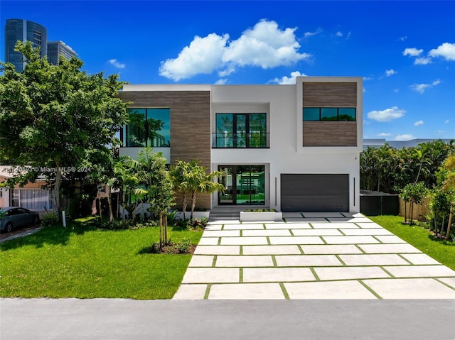 contemporary house featuring a garage and a front yard