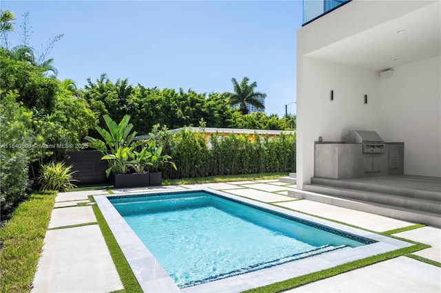 250 190th St, Sunny Isles Beach, FL 33160 - view of swimming pool featuring area for grilling, a fenced backyard, and a patio