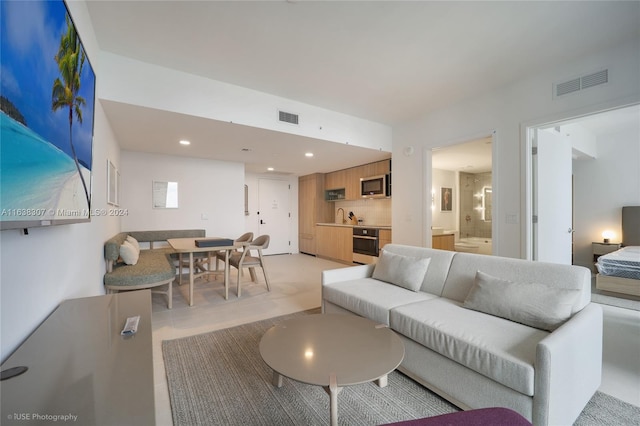 living room featuring sink