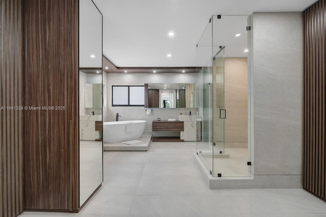 168 Fiesta Way, Fort Lauderdale, FL 33301 - bathroom featuring a shower stall, a freestanding tub, vanity, and tile patterned floors