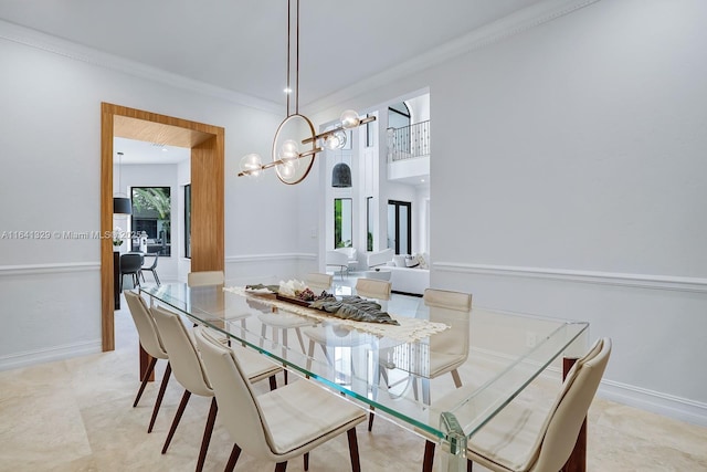 168 Fiesta Way, Fort Lauderdale, FL 33301 - dining space with a chandelier, crown molding, and baseboards