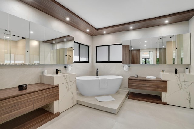 bathroom featuring tile patterned floors, vanity, tile walls, and shower with separate bathtub