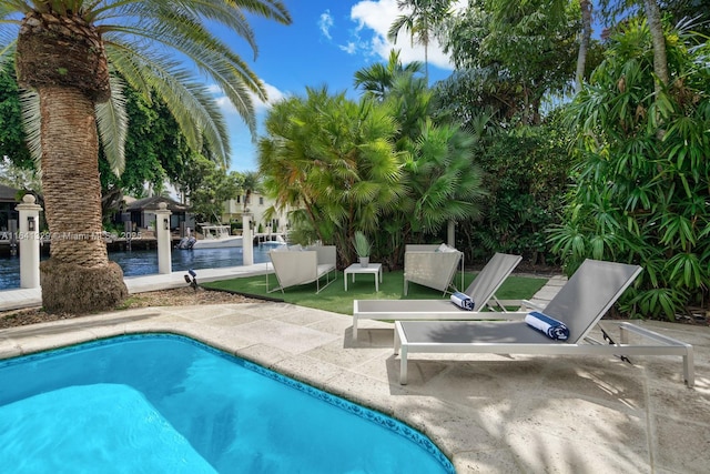 168 Fiesta Way, Fort Lauderdale, FL 33301 - swimming pool featuring a water view and a patio