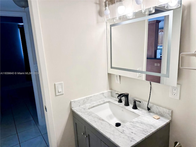 bathroom featuring tile patterned flooring and vanity