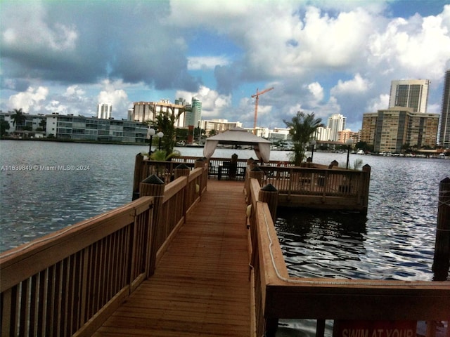 dock area featuring a gazebo and a water view