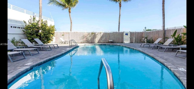 view of swimming pool with a patio area