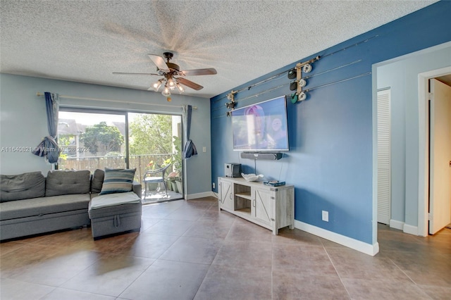 living room featuring a textured ceiling, tile patterned floors, and ceiling fan