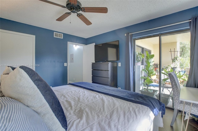 bedroom featuring ceiling fan, access to outside, and a textured ceiling